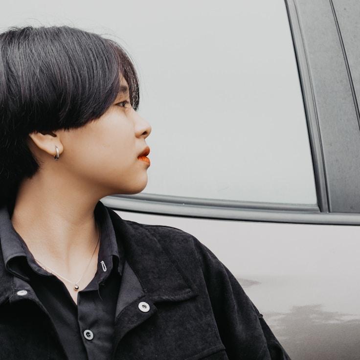 Kaveri Mehta, Lead Design Curator at BriskIslandWay, reviewing corporate floral arrangements